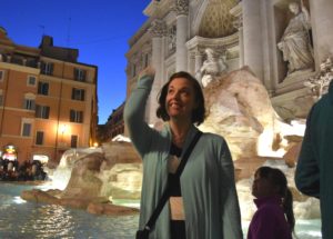 Tossing a coin into Trevi Fountain